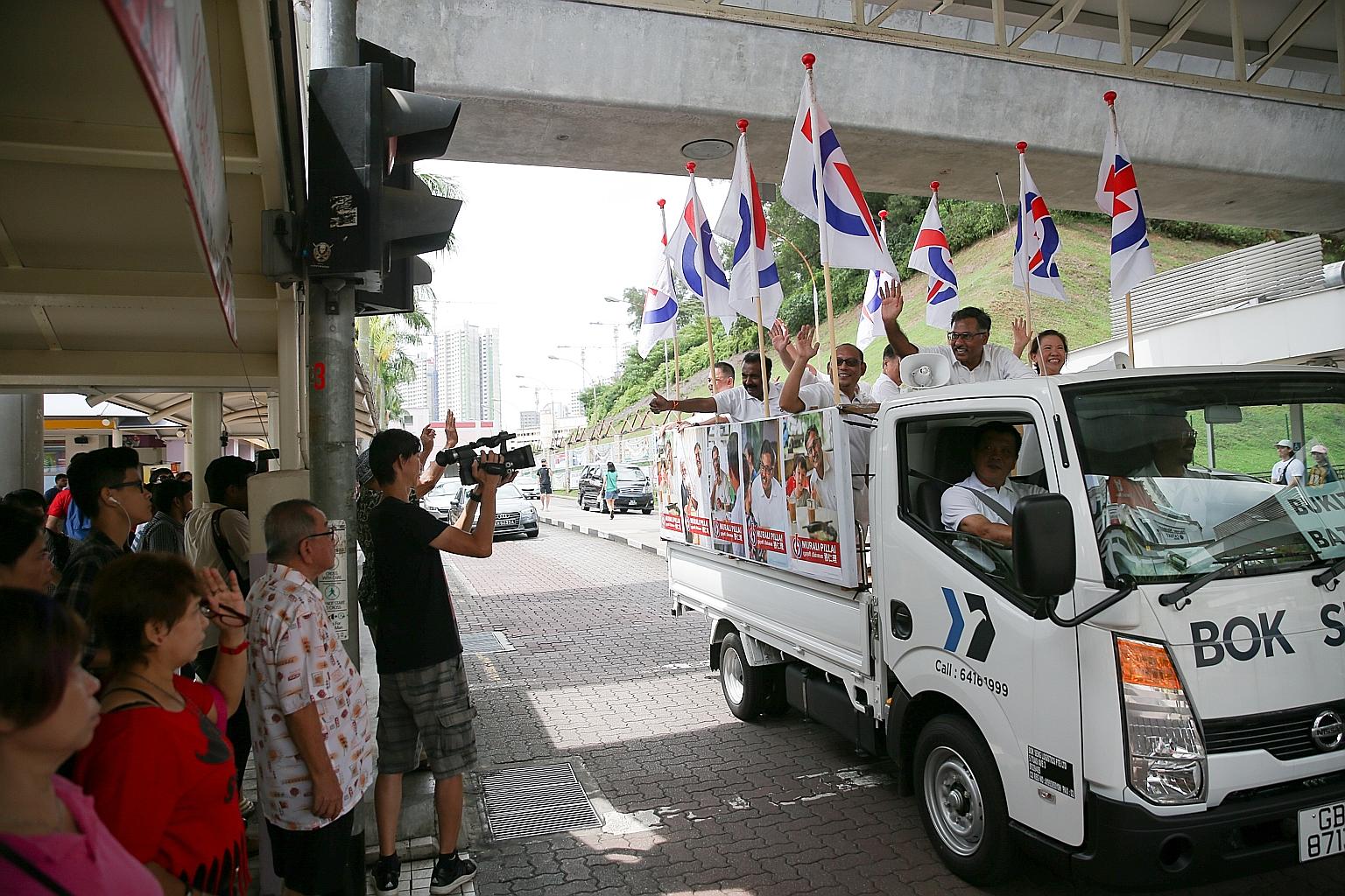Mr Murali Pillai touring Bukit Batok with party activists yesterday to thank residents for their support in Saturday's by-election. Residents can expect details of the projects he promised - such as job placement and youth mentorship programmes - in