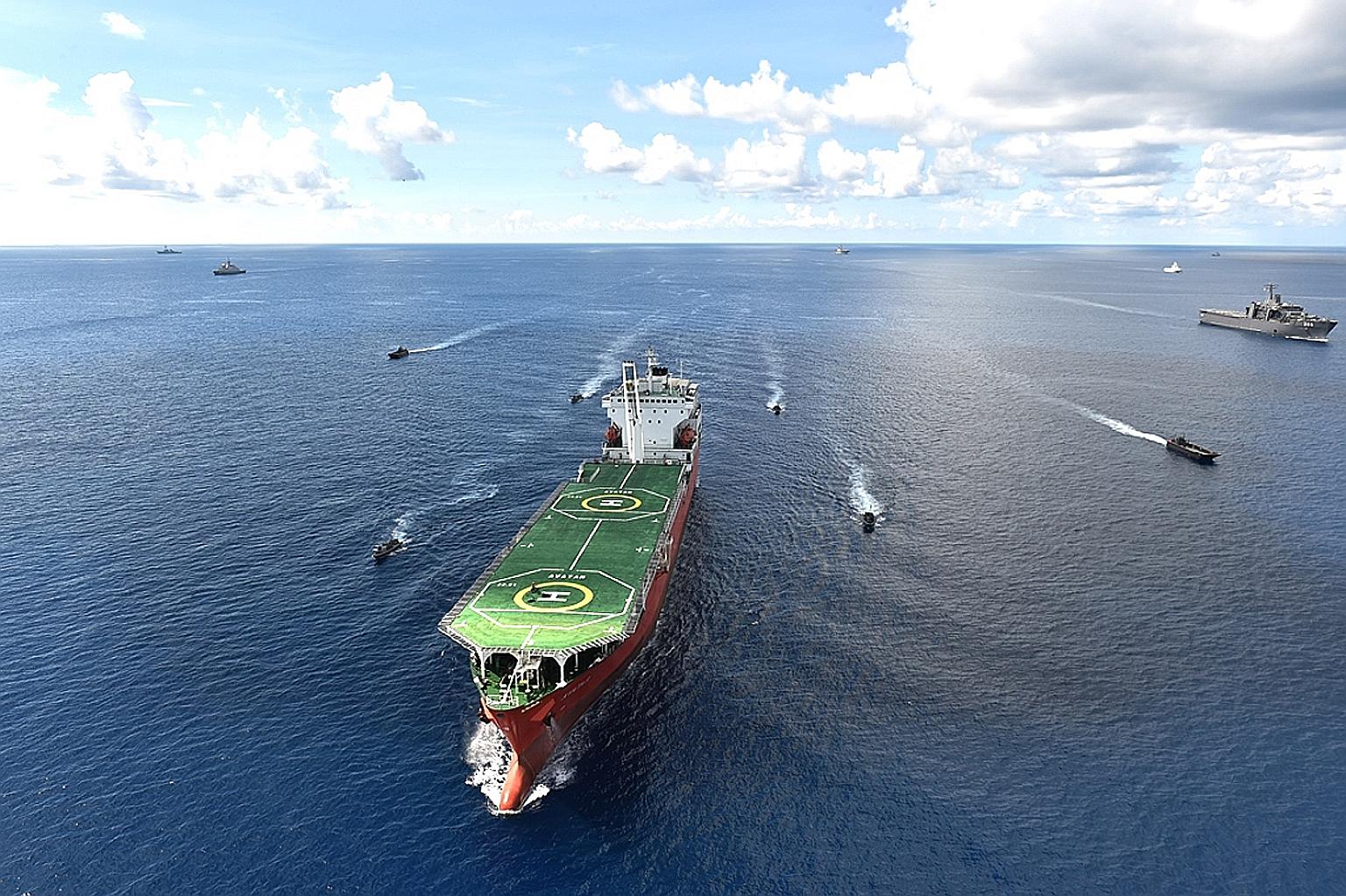 Teams from the special forces of Brunei, the Republic of Korea, Singapore and Thailand closing in on a "hijacked" merchant vessel MV Avatar, using rigid-hull inflatable boats. The counter-terrorism scenario took place during the Asean Defence Ministe