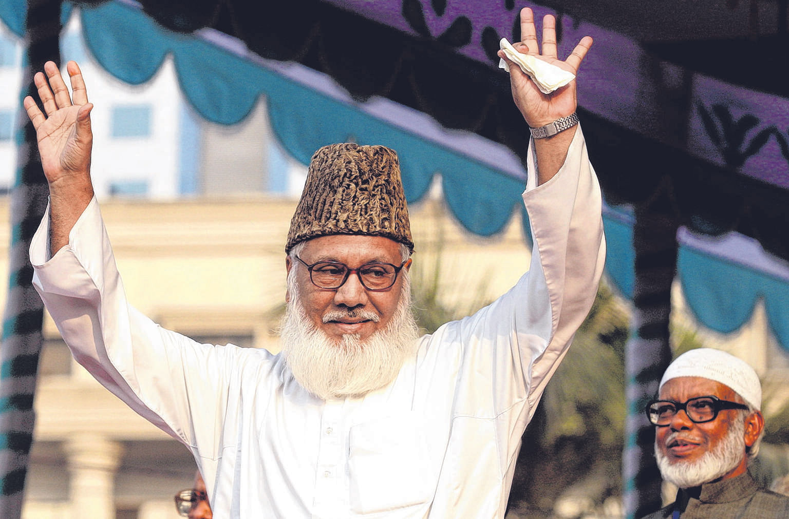 Nizami waving to his supporters during a rally in Dhaka in February 2006. He was hanged yesterday after being found guilty of eight charges, including genocide, torture and rape during the 1971 Liberation war with Pakistan.