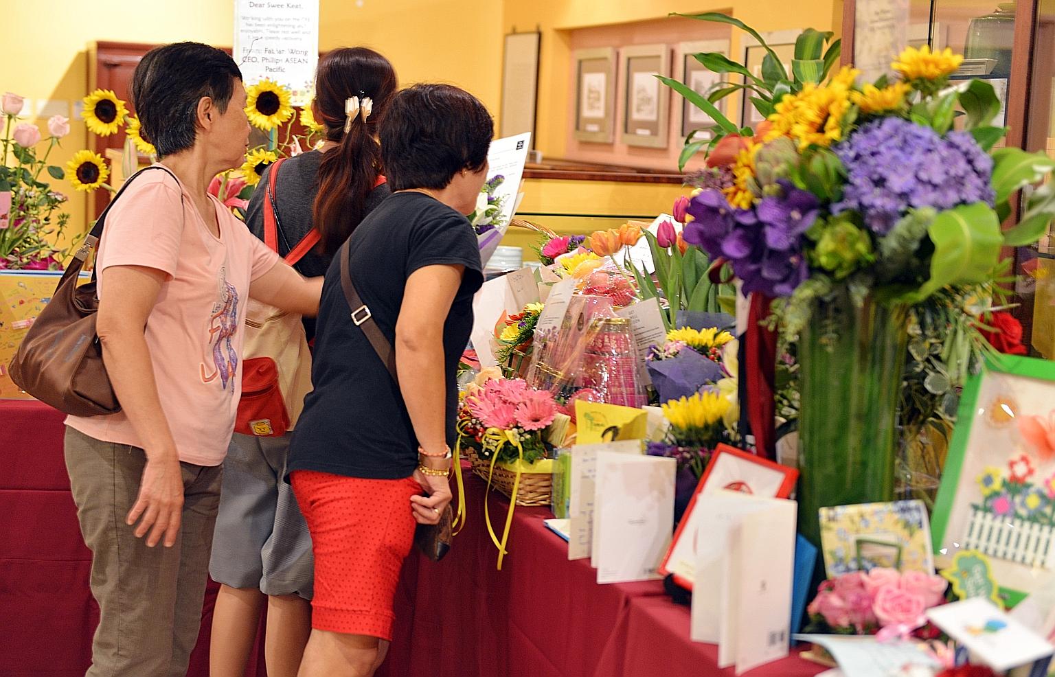 Visitors yesterday left cards and flowers at Tan Tock Seng Hospital to wish Mr Heng a speedy recovery. The minister had been warded after suffering a stroke.