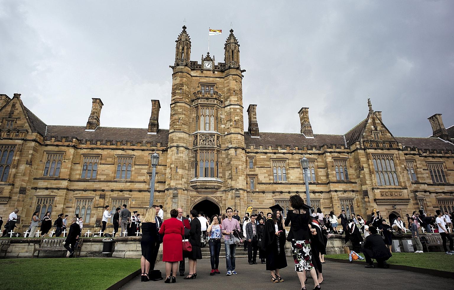Students and their family members on the campus of the University of Sydney after a graduation ceremony. Australian government figures show that the number of Singaporeans enrolled in law, postgraduate medicine and allied health has grown.