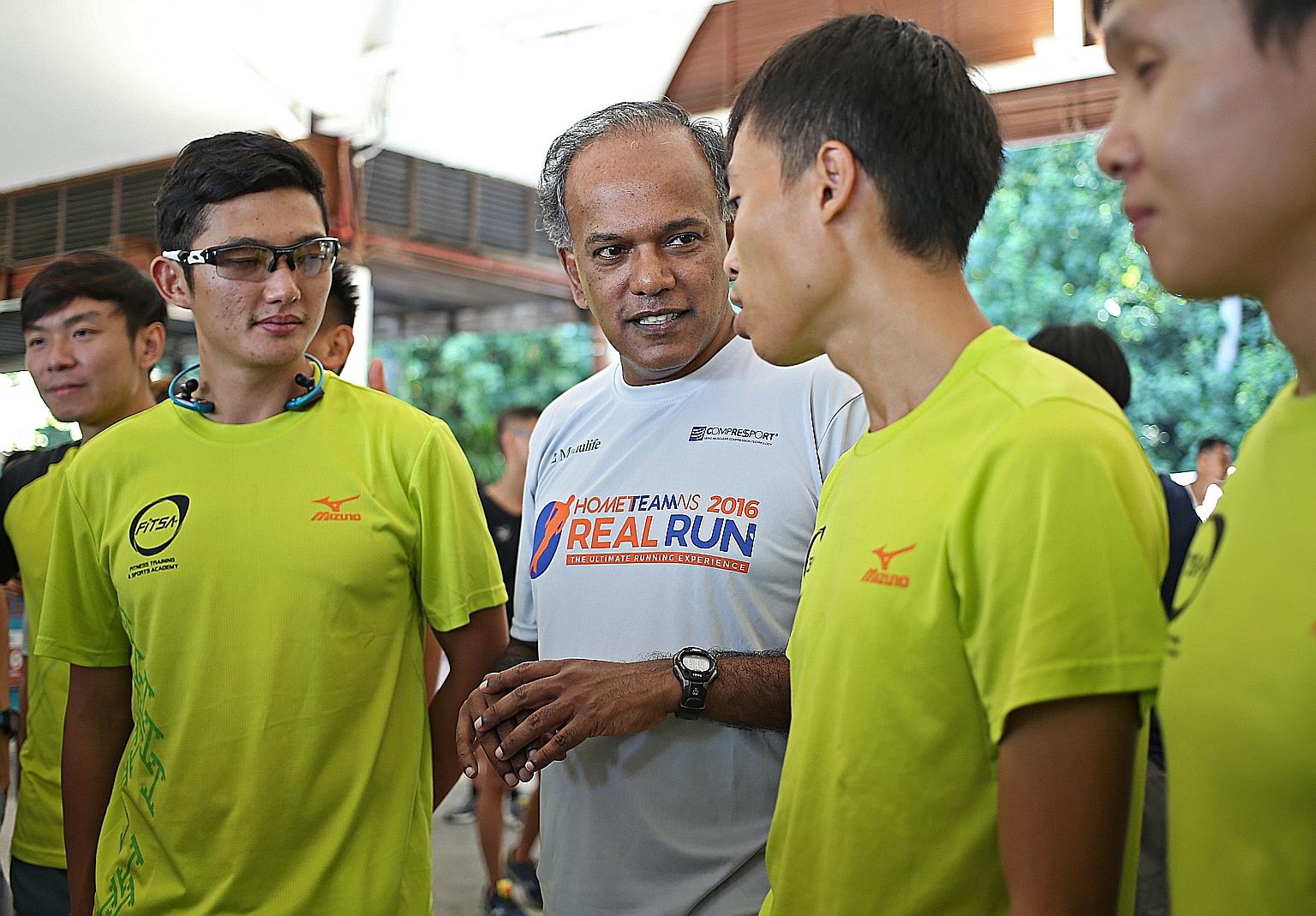 Mr Shanmugam with participants in the HomeTeamNS Real Run held on Sentosa yesterday. The minister said pilot trials related to SG Secure will begin next month in some constituencies, including his own Nee Soon GRC.