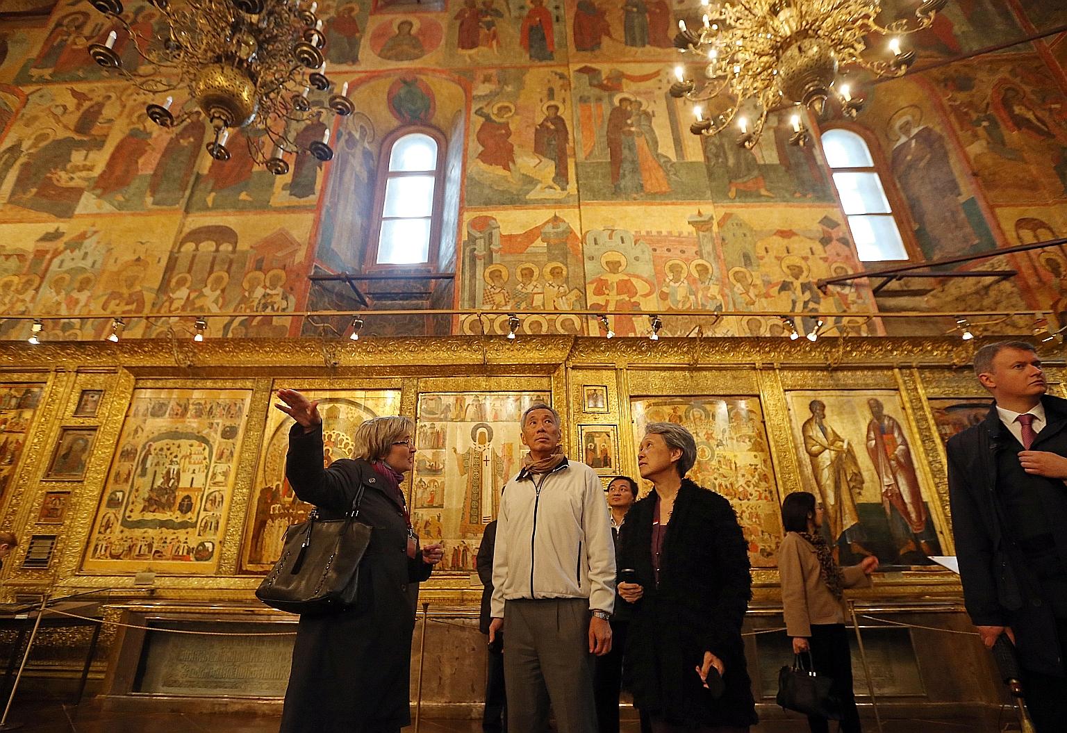 PM Lee and Mrs Lee inside the Dormition Cathedral of the Moscow Kremlin yesterday. At Red Square and the Kremlin, he bumped into Singaporeans on holiday.