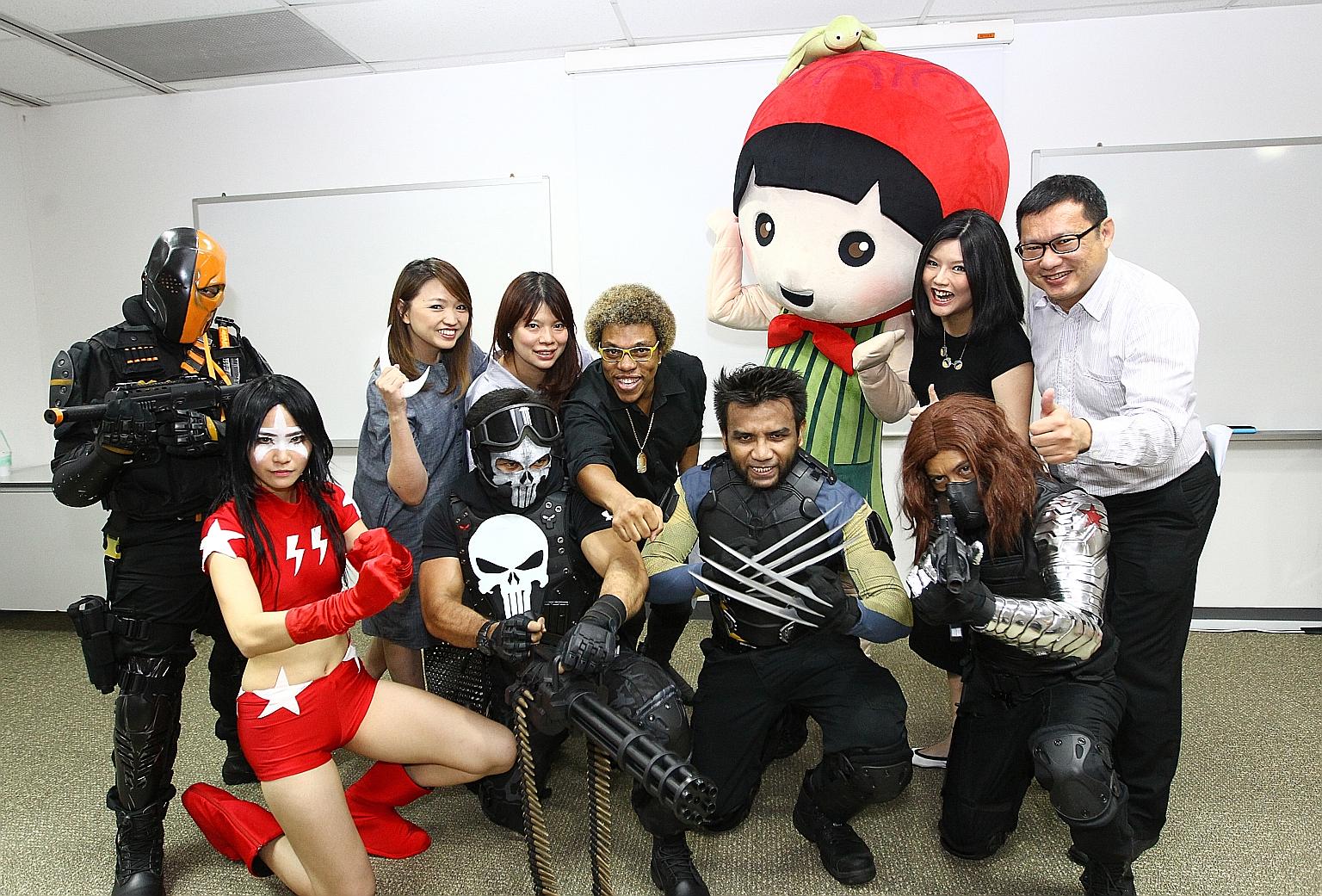 (Back row, from left) UFM100.3 programme director Carine Ang, The Travelling Chef on Wheels founder Karen Cheng, ACAS president Jerry Hinds, Ms Wang and Mr Chua with cosplayers from ACAS at the launch of Singapore Book Fair 2016.