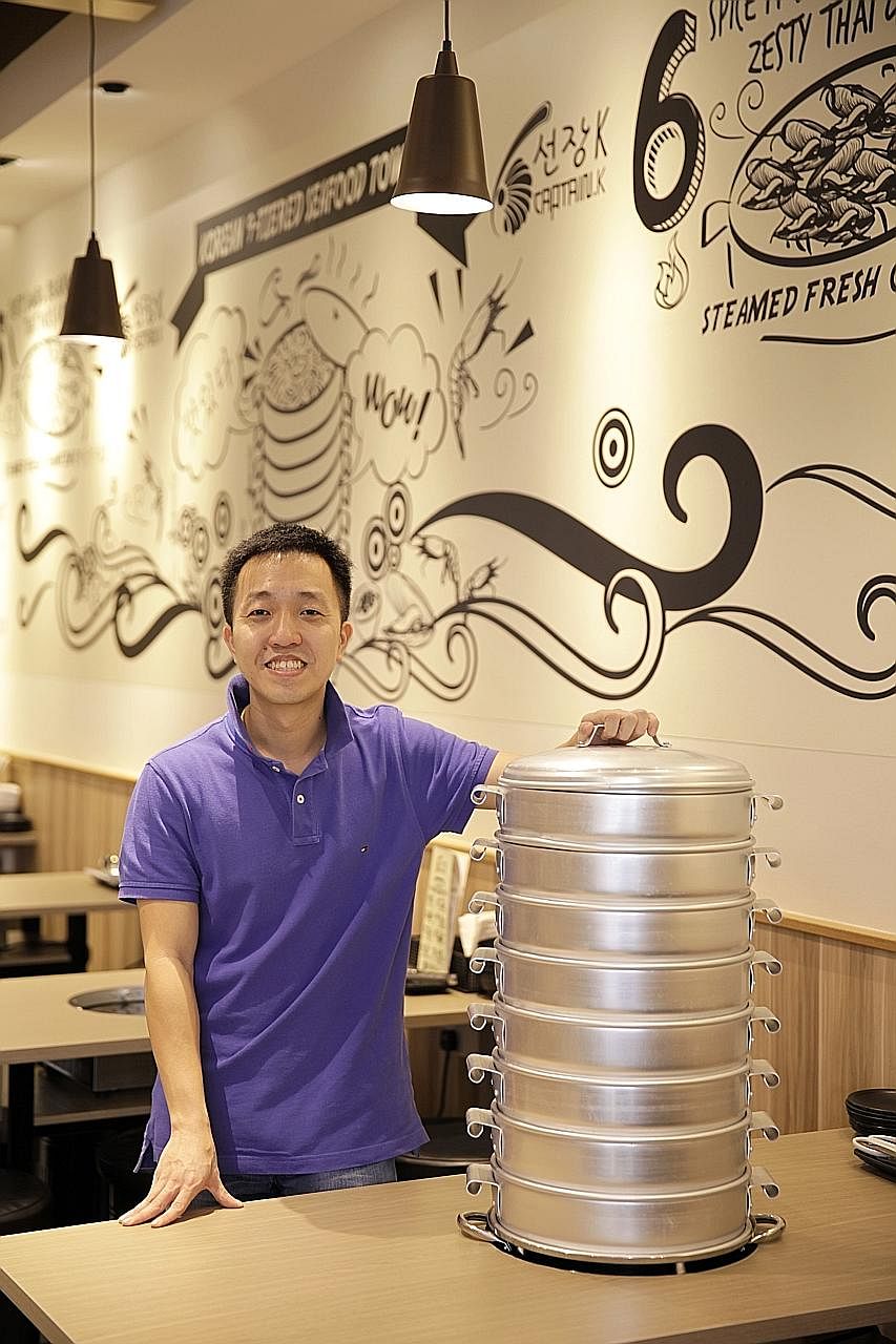 Captain K Seafood Tower owner Kenneth Koh sells seafood cooked in a stack of steamers.