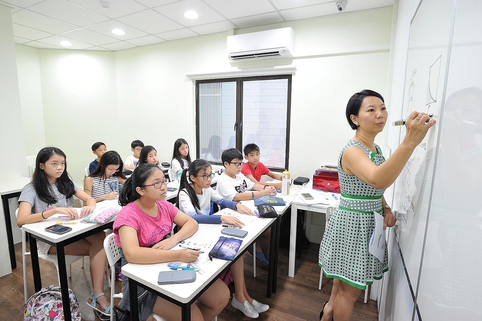 Ms Janice Chuah, 43, teaching a class at Concept Math Education Centre, which she founded. Revenue has hit $1 million a year for the past few years.