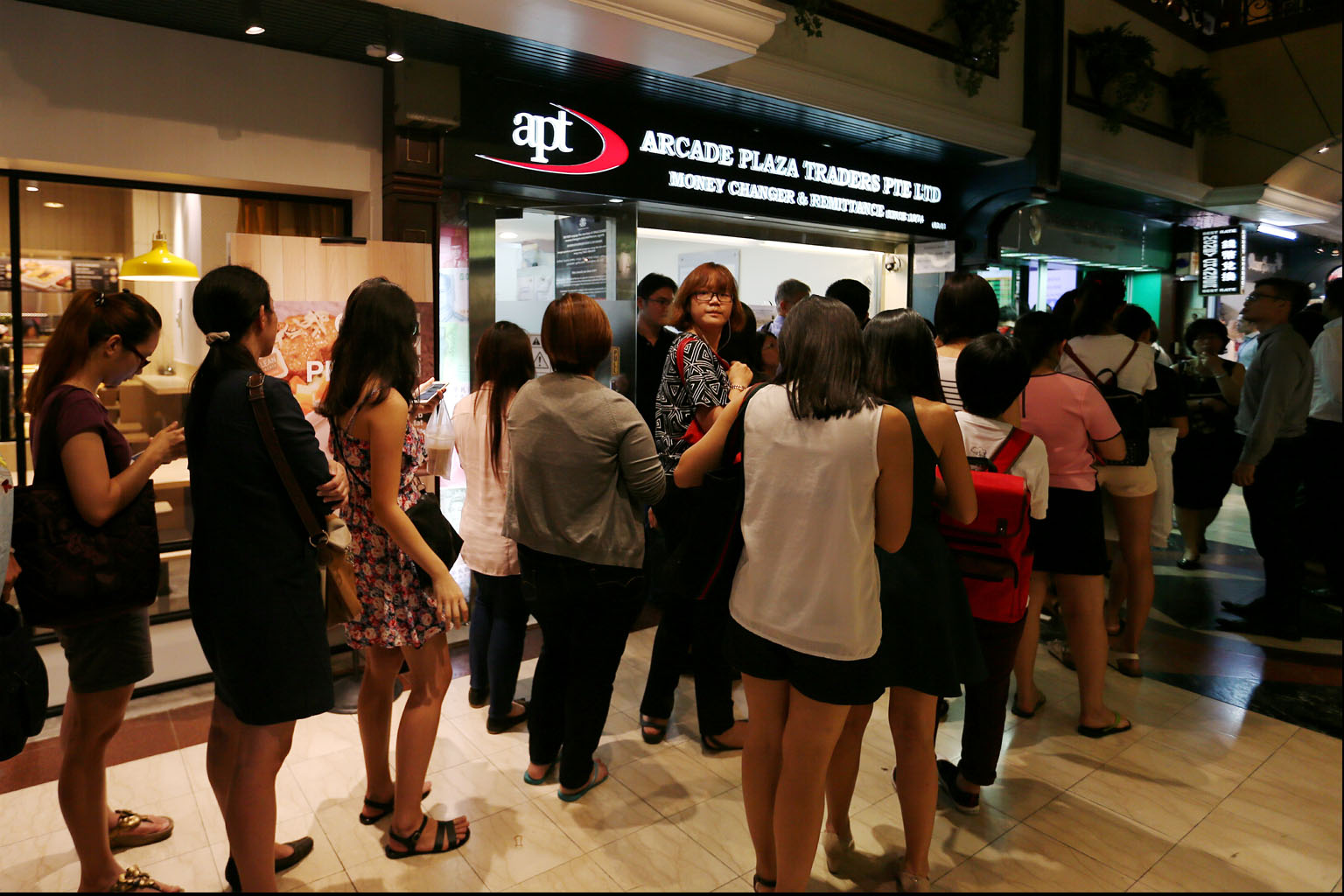 The queue at a moneychanger in Raffles Place when the ringgit hit a low last year.