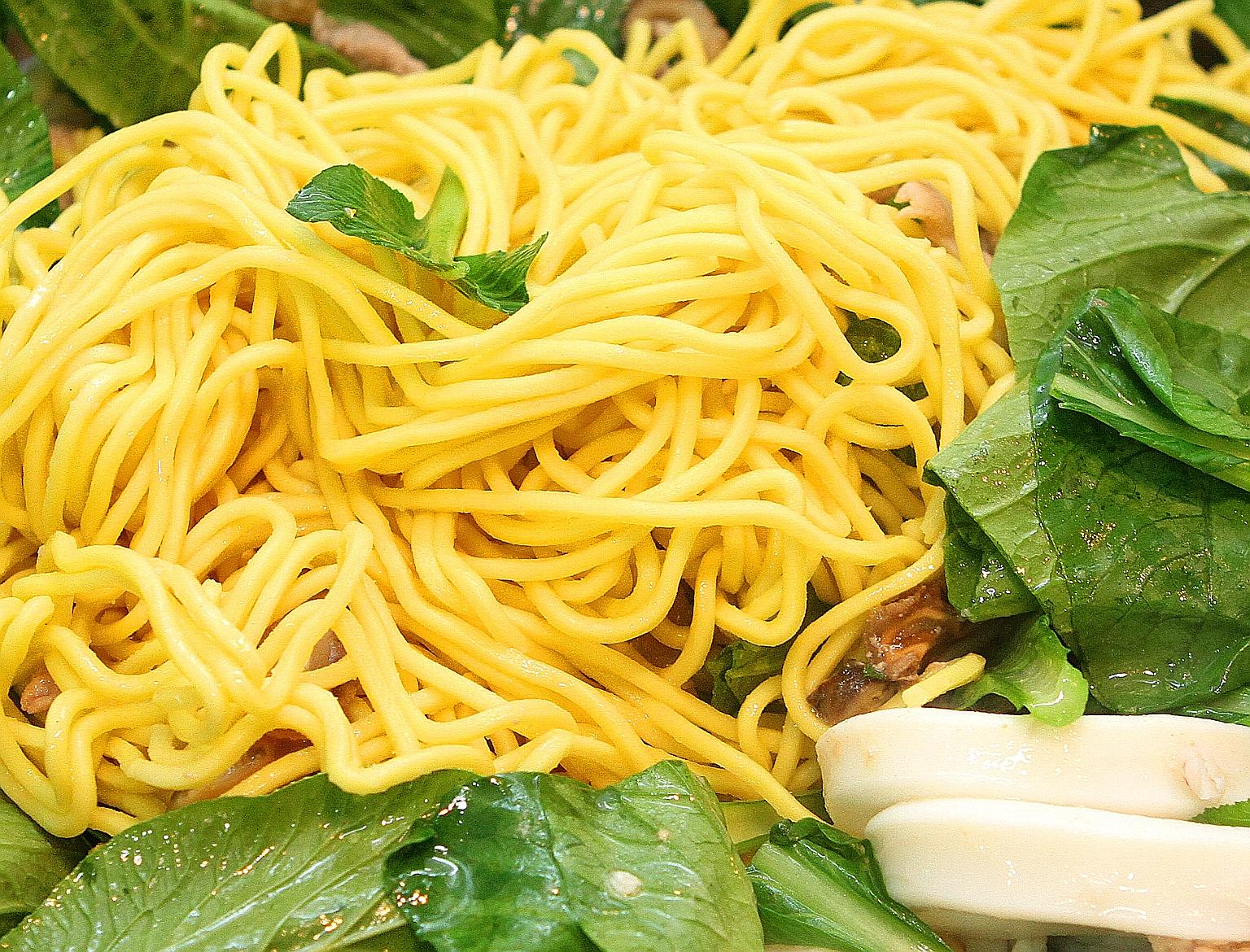 Lye is added to yellow noodles to prevent them from disintegrating when cooked in soup.