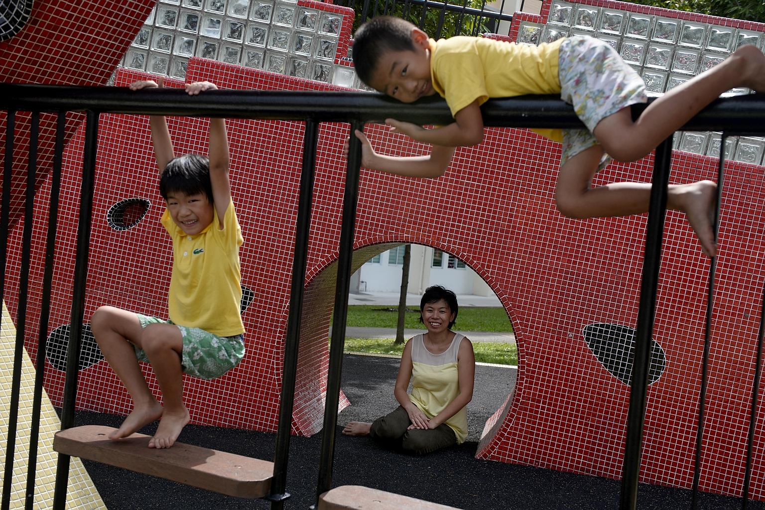 Mrs Sarah Lee-Wong with her sons Elisha (left) and Ezekiel at a watermelon mosaic playground in Tampines. The homeschoolers have been studying playgrounds as part of a project exploring play spaces.