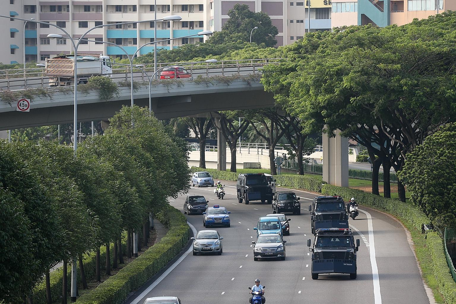 Armoured vehicles taking the Bangladeshi suspects to court yesterday. Four of six men charged last Friday pleaded guilty to financing terrorism. The other two are claiming trial.