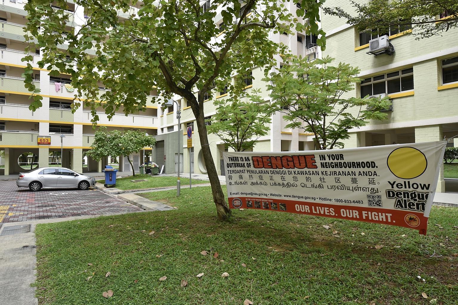 Jalan Tenaga (left), an estate of mostly HDB housing near Eunos, was where the latest dengue victim had lived. However, residents have said they are not worried and have gone about their lives as usual.
