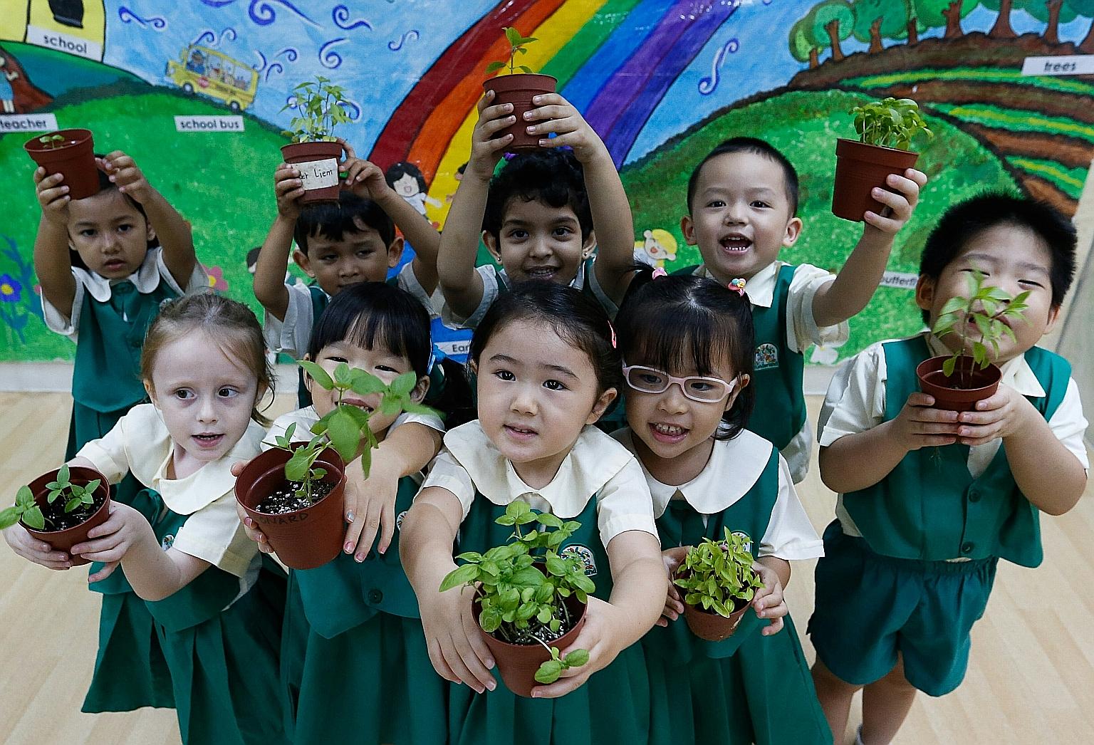 In celebration of World Environment Day tomorrow, 1,400 children from Kinderland pre-schools, including those pictured here at its Pandan Valley branch, are turning into little farmers for a good cause. Children as young as 18 months to those as old