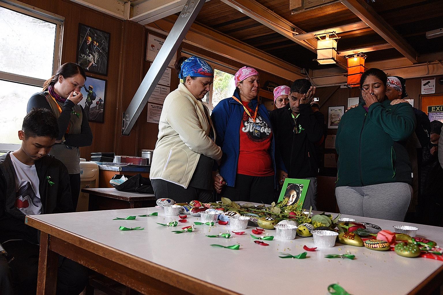 At Pendant Hut in Laban Rata, 3,289m above sea level on Mount Kinabalu yesterday were (from left) quake survivor Elliot Quok and his mother Mae Molina; Ms Amos Mystica Conceicao; and Mrs Karen Jhala, Mr Jaidipsinh Jhala and Ms Karishma Jhala, the par