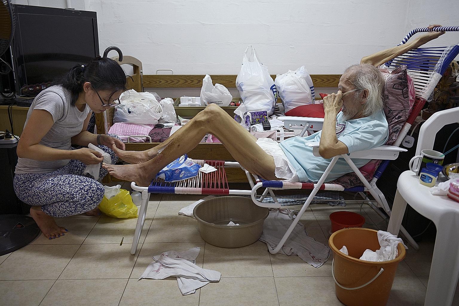 Ms Loo and a doctor leave a patient's flat in MacPherson. The nurse has about 40 patients under her care and visits an average of three every day - half the time on her own and other times with a doctor. She moves around with at least two cellphones,