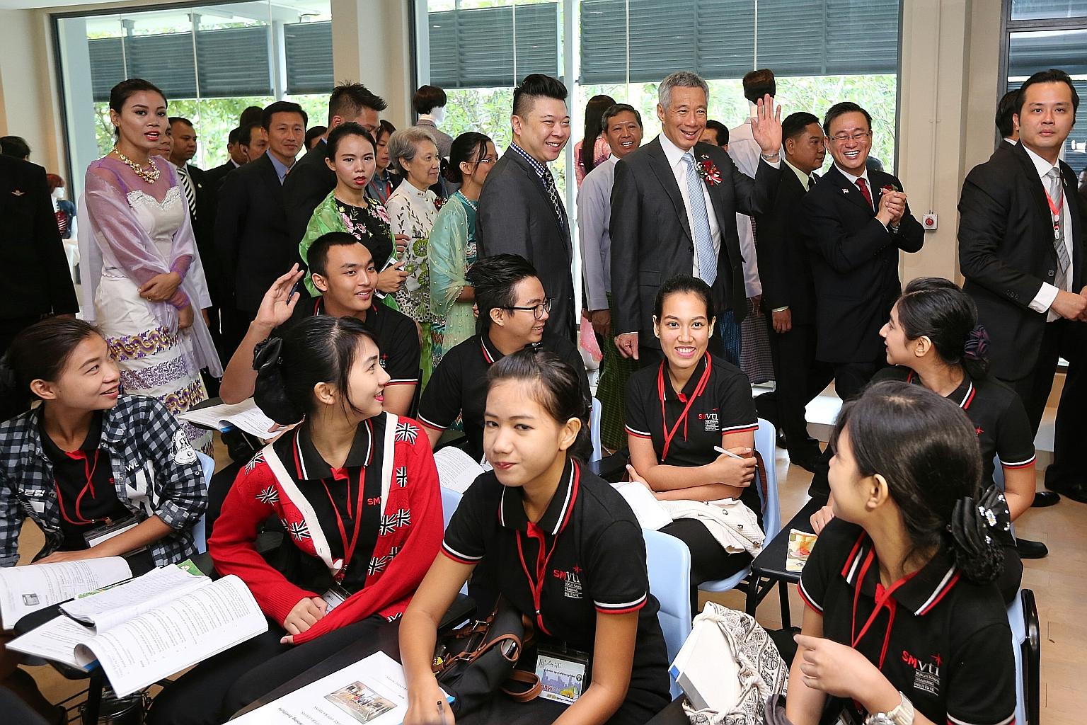 PM Lee touring the campus of the Singapore-Myanmar Vocational Training Institute with Mrs Lee and Mr Ong on the final day of his three-day visit to Myanmar yesterday. The school is modelled on Singapore's ITE.