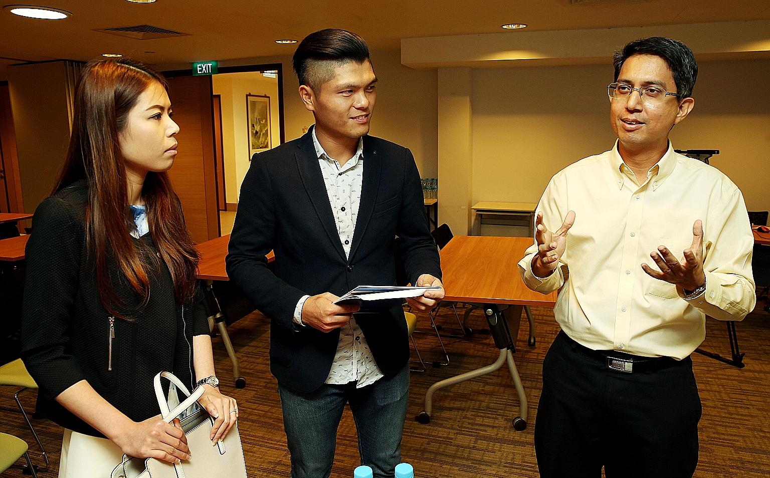 Dr Faishal (right) with Ms Wong and Mr Koh who attended the programme's introductory session yesterday. The couple found it relevant and practical in helping them to pinpoint and work out issues.