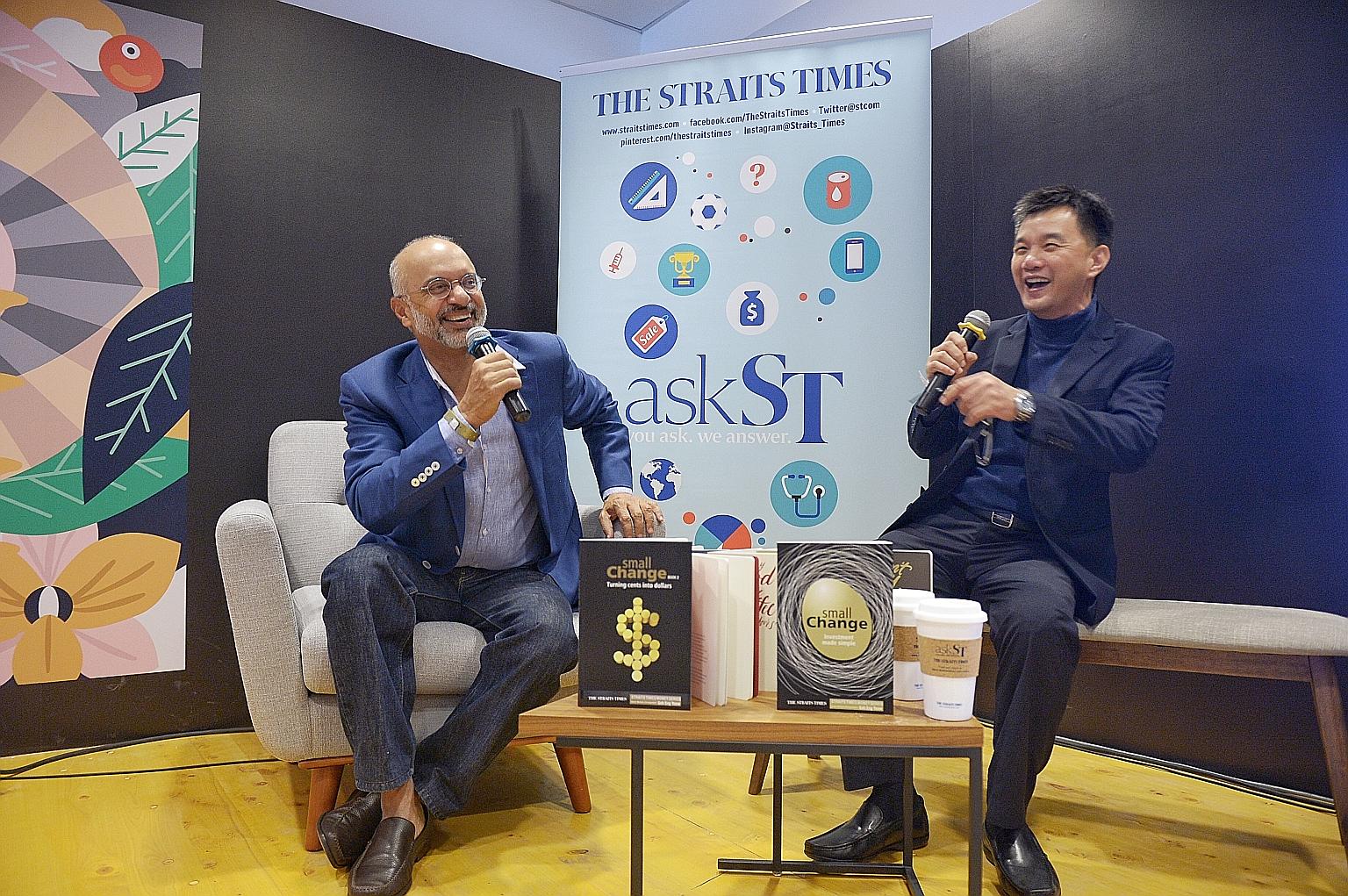 Mr Gupta (left) and Mr Goh sharing a light-hearted moment in the ST Reading Room yesterday. Over 100 people gathered to hear Mr Gupta's insights on issues such as investment and the state of the world economy.