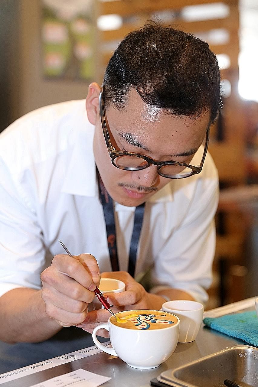 2015 World Latte Art champion Caleb Cha working his magic yesterday. Visitors could pay for their preferred latte art, and the money would be donated to the DaySpring Residential Treatment Centre which helps abused teenage girls.