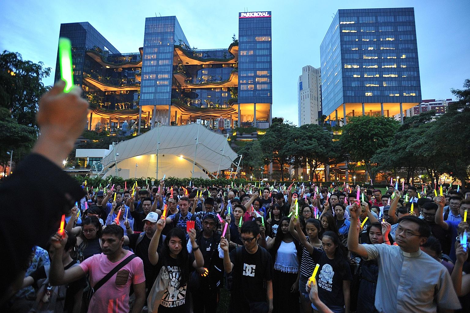 More than 700 people joined a candlelight vigil at Hong Lim Park last night following the Orlando gay club shooting. Members of Singapore's LGBT community said they do not rule out the possibility of violence taking place here and called for a dialog