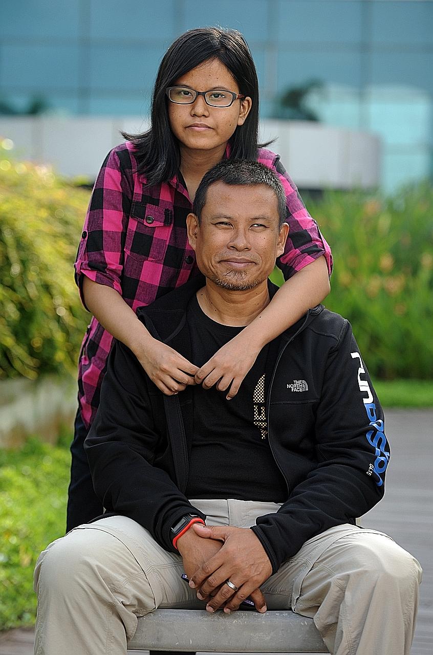 Mr Shariff with his 16-year-old daughter Athirah, who has liver cirrhosis. The 47-year-old, who runs marathons despite having his left limb amputated in 2008 because of a skin infection, calls Athirah his "biggest motivation".