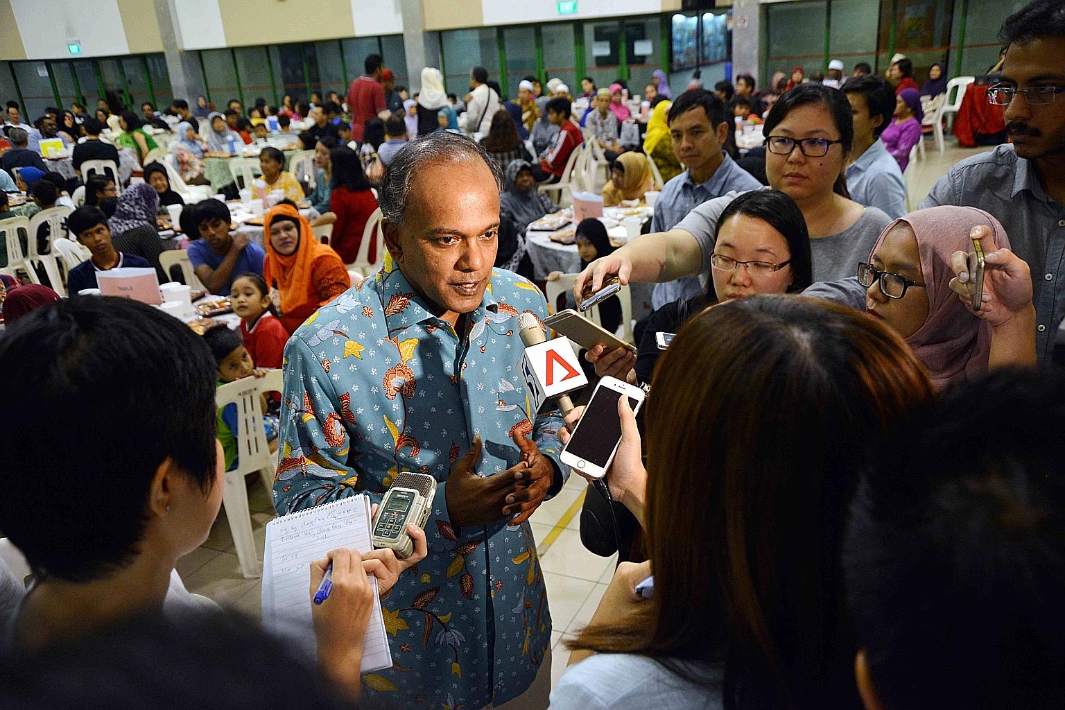 Mr Shanmugam speaking to reporters before the iftar at the Chong Pang Community Club yesterday, where more than 400 residents broke fast together.
