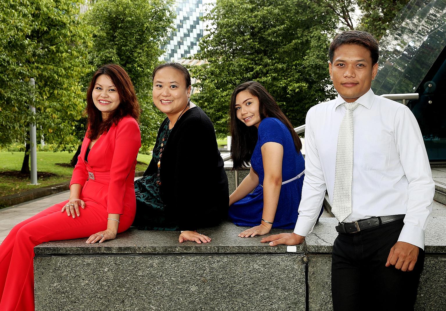 Ms Ling (in red), and some employees of her new firm (from left) Ms Ching, Ms Tania Ahchak, 24, and Mr Mohammad Nurmahadi, 38.