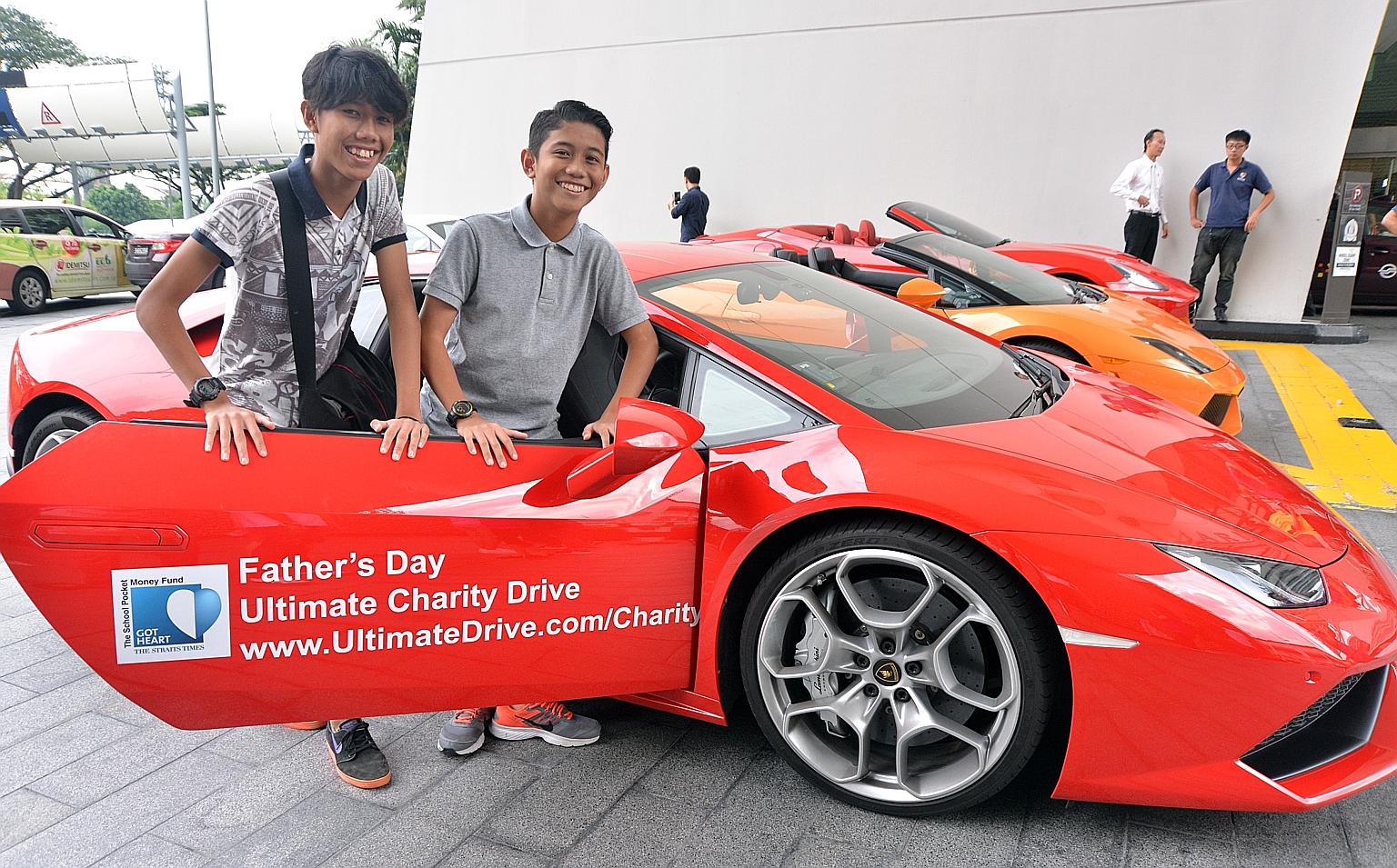 Sixteen-year-old Mohd Nabil Iman (left) and 14-year-old Mohd Naufal Ilham were among those who caught a ride in a supercar yesterday as part of a charity drive to raise funds for The Straits Times School Pocket Money Fund. The drive, a partnership wi