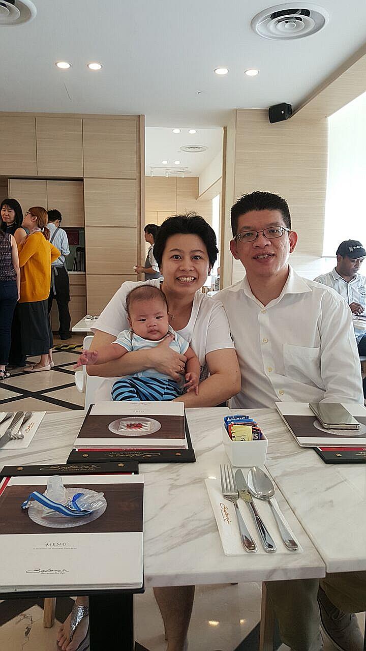 Ms Felicia Tan with husband Low Lieneng and their precious bundle of joy, Titus.