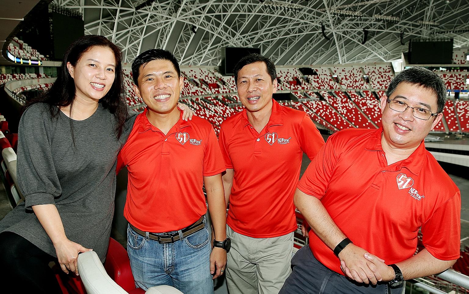 Thirty operationally ready national servicemen have volunteered to help out for this year's National Day Parade - a record number. Among them are LTC (NS) Hoe (second from left) who also roped in his wife Priscilla (extreme left); Col (NS) Lam (third
