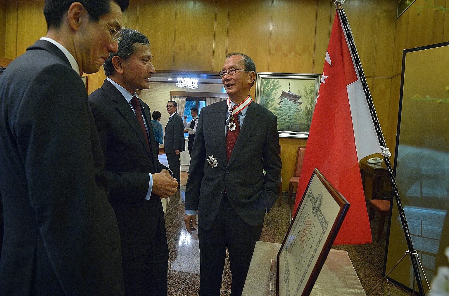 Former ambassador to Japan, Mr Chew (right), with the Japanese Ambassador to Singapore, Mr Shinoda (left) and Dr Balakrishnan after Mr Chew was conferred the Order of the Rising Sun, Gold and Silver Star.