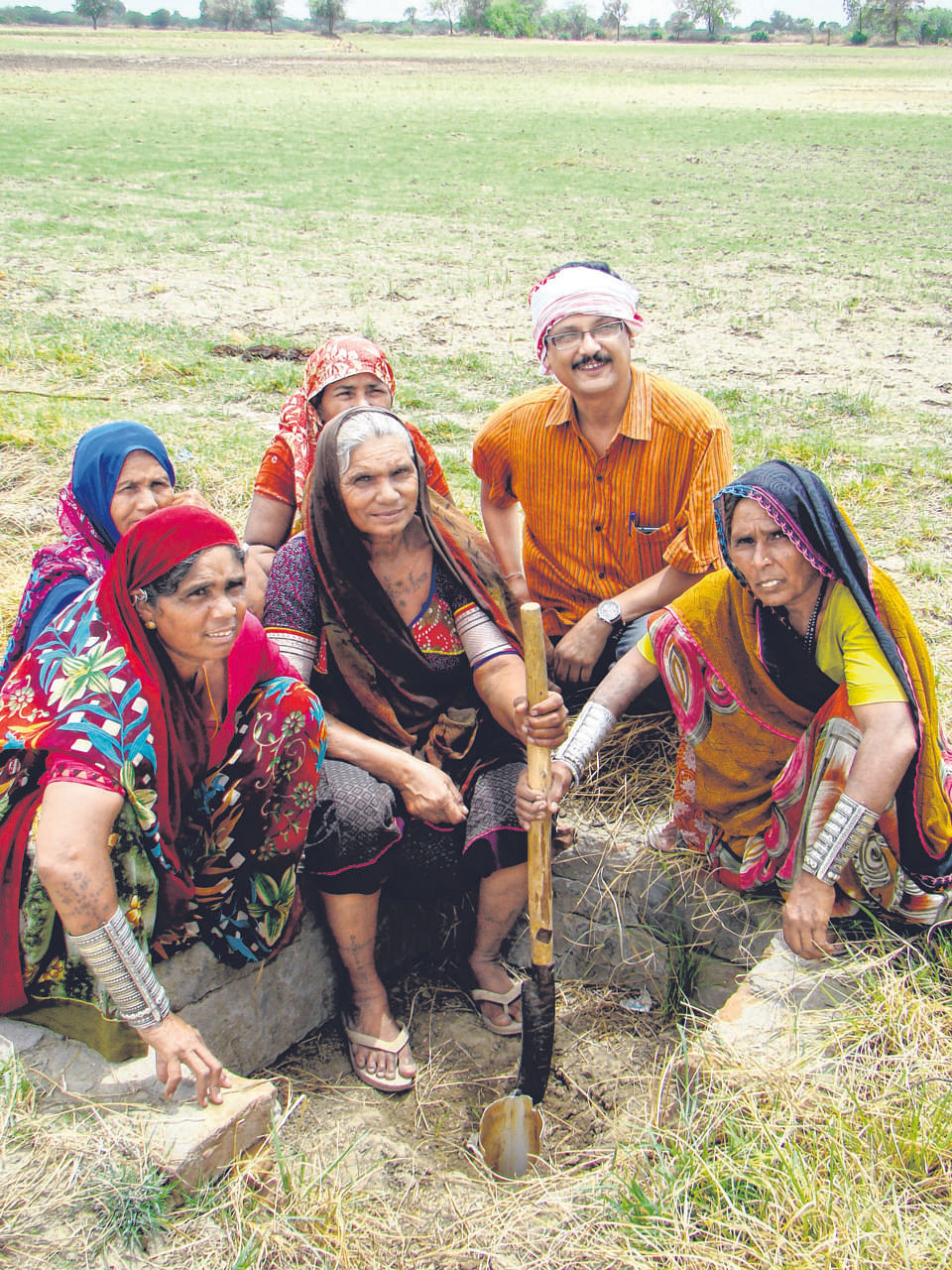 Naireeta Services director Biplab K. Paul with village women who have benefited from Bhungroo, a water management system.