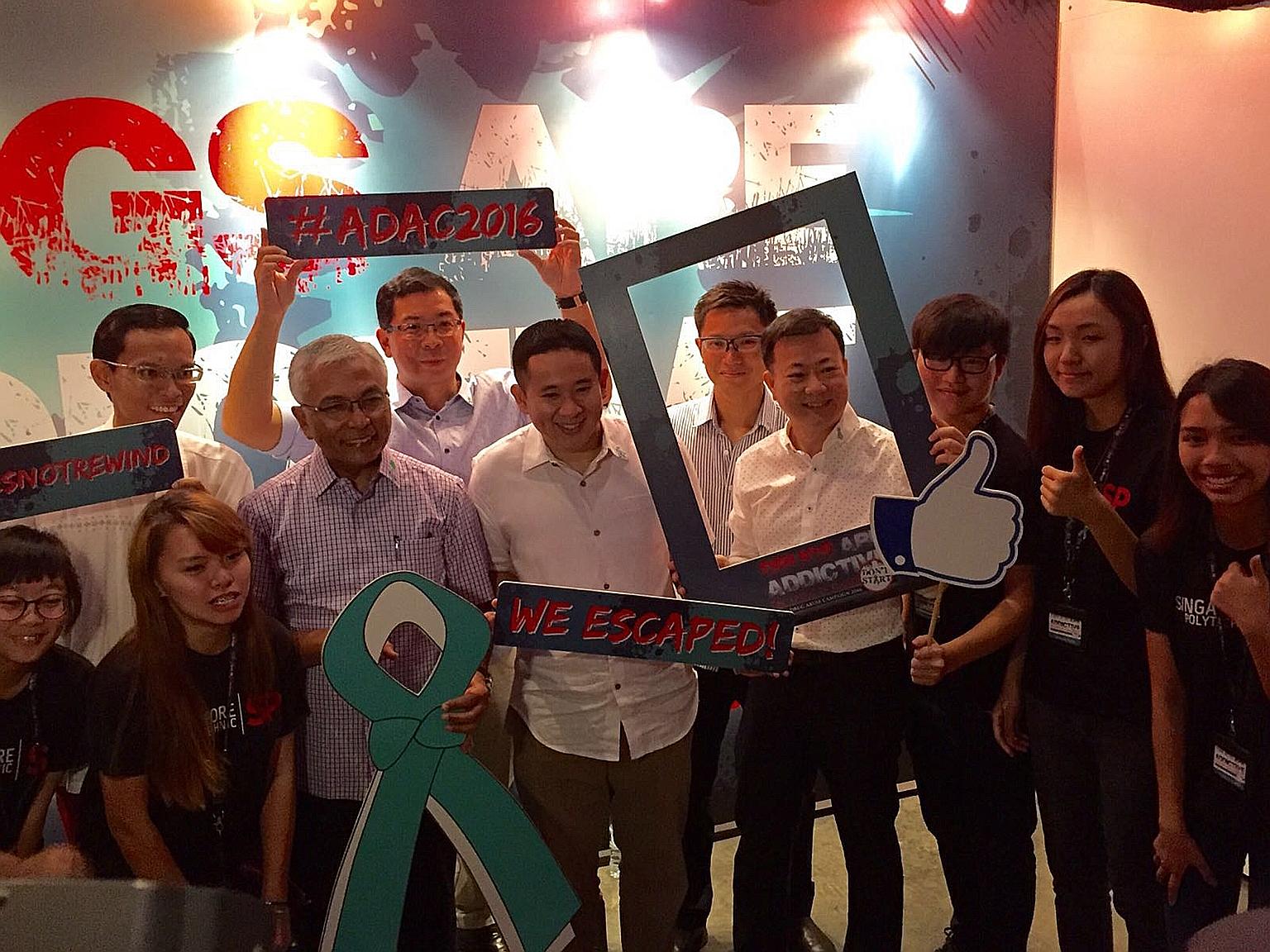 Parliamentary Secretary Amrin Amin (front row, centre); Mr Hawazi Daipi (third from left), vice-chairman of the National Council Against Drug Abuse; NCADA chairman Victor Lye (fourth from right); and CNB deputy director Winston Wong (back row, second
