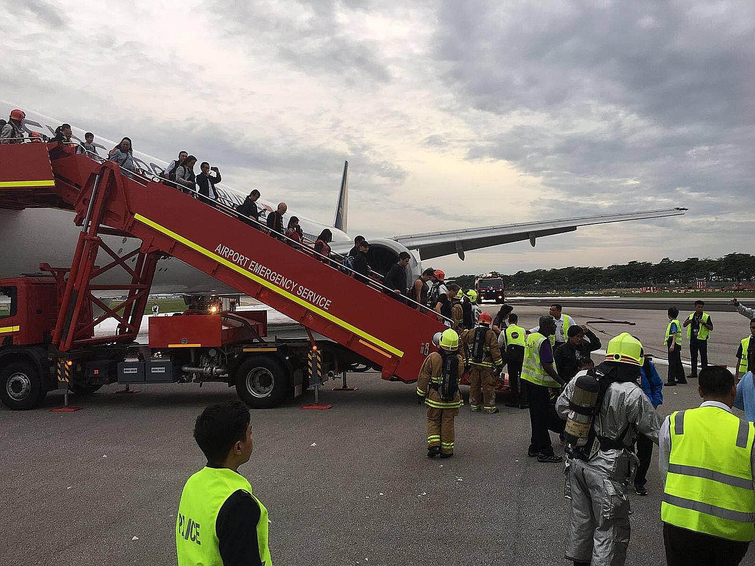 It took about five minutes for the fire on Flight SQ368's right wing to be put out, during which time passengers were kept on board. They were allowed to leave only after firefighters had put out the blaze.