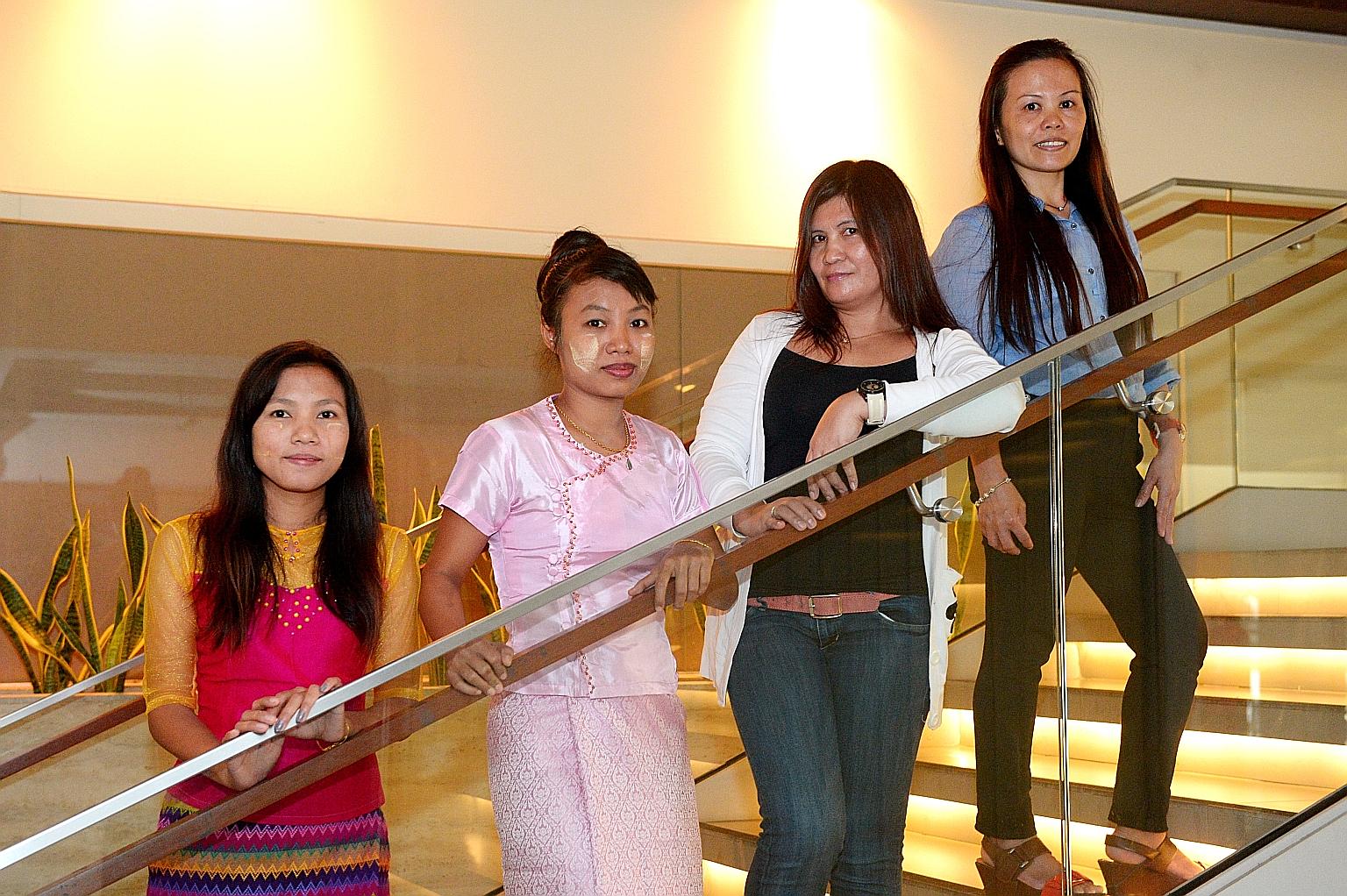 Foreign domestic workers (from left) Ms Khin Nilar Win, 29; and Ms Nwe Nwe Oo, 30, both from Myanmar; and Ms Cristina Ganancial Alvarez, 41; and Ms Maria Ivy Gemina Secong, 47; both from the Philippines.