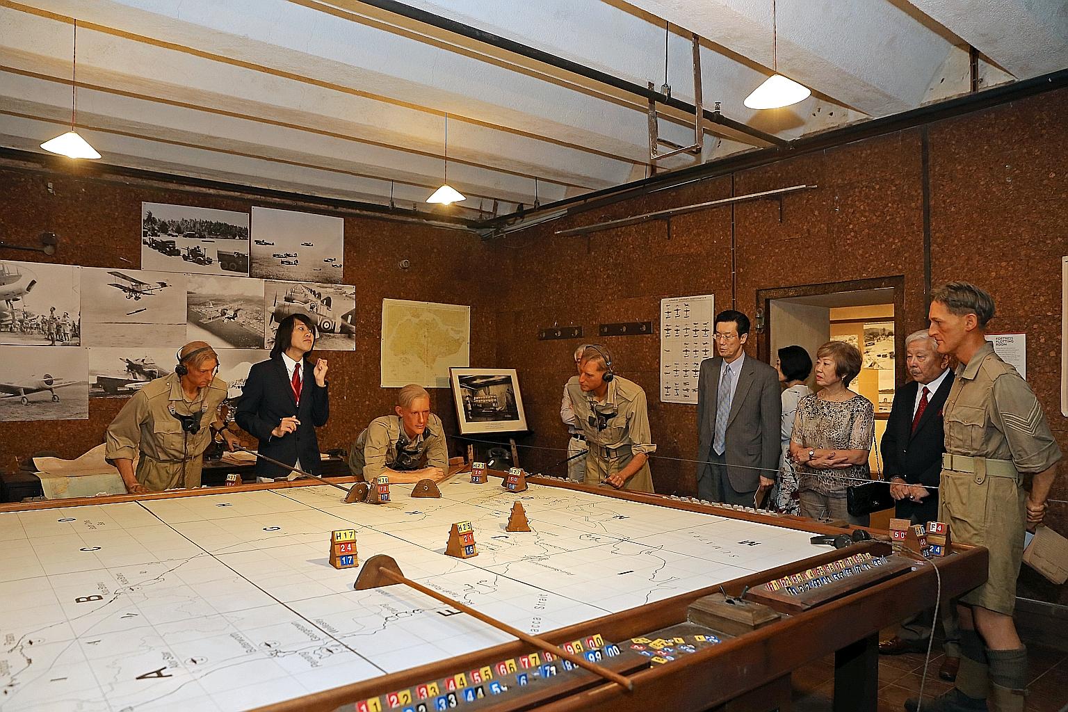 Standing among the wax figures are (from left) Mr Eisen Teo, a tour guide with Singapore History Consultants; Mr Shinoda, Japan's Ambassador to Singapore; Mrs Katherine Choo; and Mr Winston Choo, a former Chief of Defence Force. The refurbished Battl