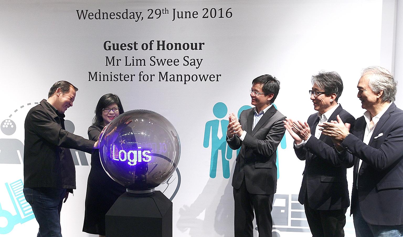 Manpower Minister Lim Swee Say (second from right) at the Logistics PCP launch yesterday with (from left) Scala academy director Paul Lim; WDA enterprise development group senior director Julia Ng; WDA chief executive Ng Cher Pong; and Scala founding