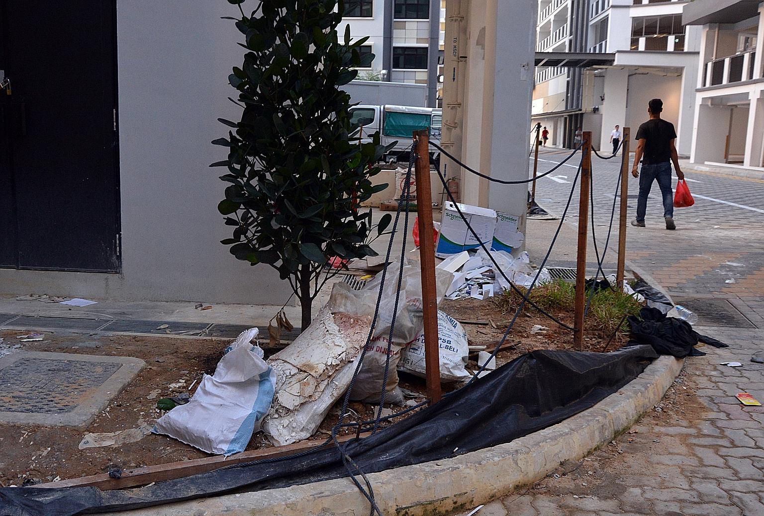 Construction materials and other bulky items were seen strewn about on the walkways and pavements around the new blocks in Choa Chu Kang Avenue 7 yesterday.
