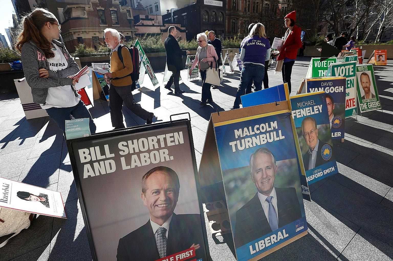 Candidates like Mr Shorten (above, left, featured in a promotional poster near a Sydney polling centre) and Mr Turnbull have mostly kept their campaigns free of the vitriol seen in other recent political contests.