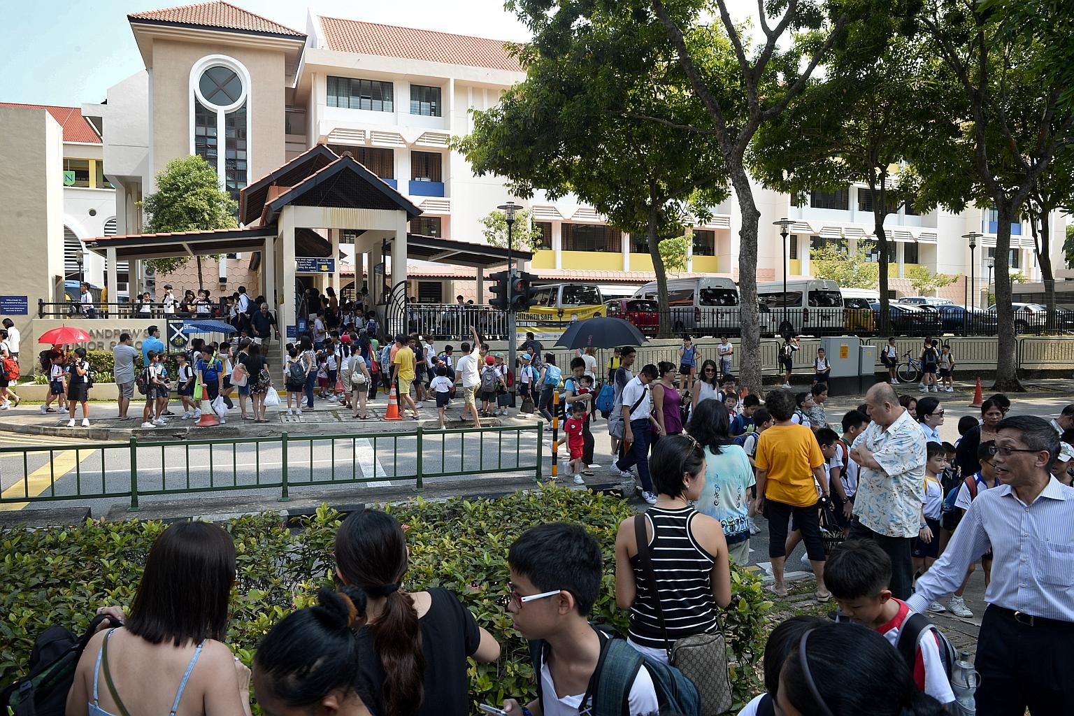 Schoolchildren from St Andrew's Junior School, which is part of St Andrew's Village, leaving the school last Friday. Since the new term began, all visitors, including parents, are not allowed to drive or walk into the school complex without a pass or