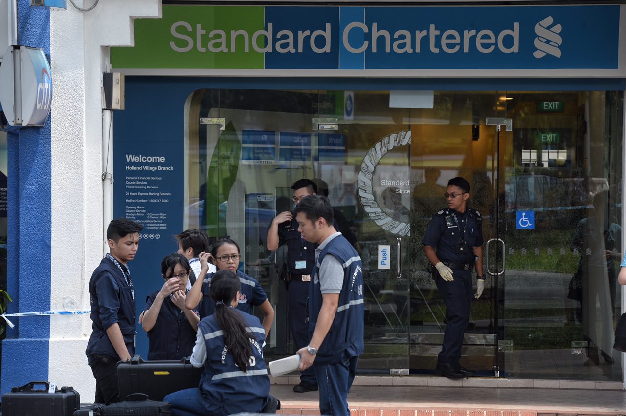 Police officers searching for suspect after robbery at Standard Chartered  bank in Holland Village | The Straits Times