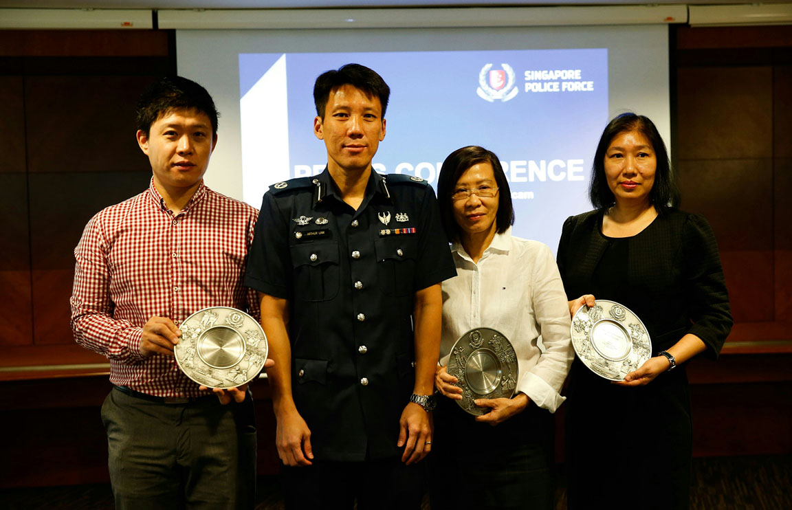 Deputy Assistant Commissioner of Police Arthur Law with Mr Li, Ms Thng and Ms Clara Ling yesterday. Ms Ling collected the Public Spiritedness Award on behalf of Ms Han.