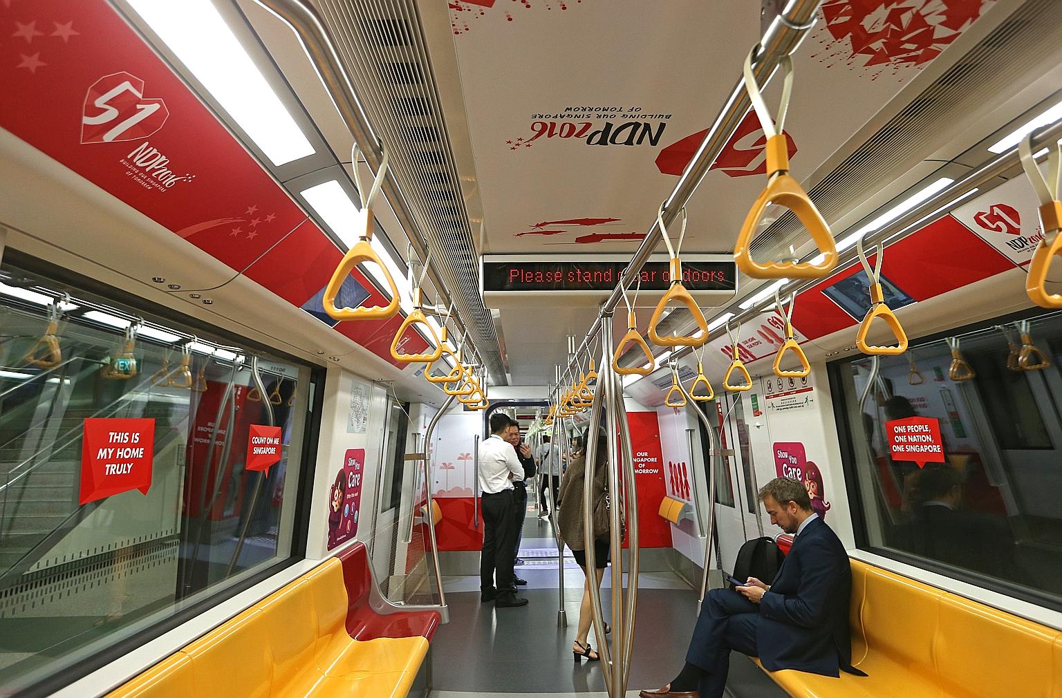 Four trains awash in red and white will be running on different MRT lines until mid-August. Two of them began service yesterday.