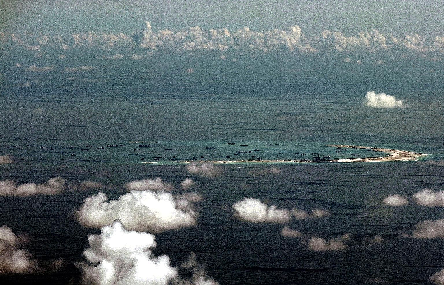 An aerial photo taken on May 11 last year shows alleged reclamation works by China on Mischief Reef. The UN-backed Arbitral Tribunal ruled that Mischief Reef is a low-tide elevation, not an island, and that it is located within the exclusive economic