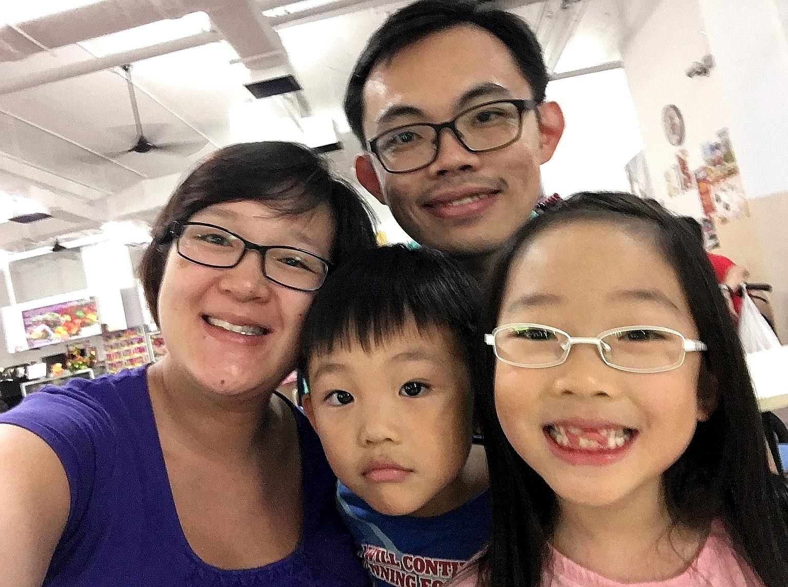 Mr Low with his wife, Ms Elaine Chow, and two of their children, David and Emma.