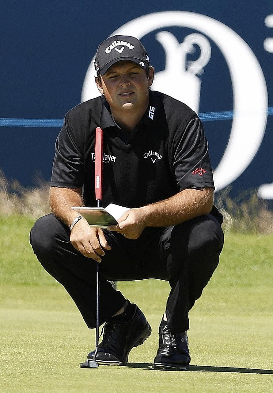 Patrick Reed of the United States lining up a putt on the 18th green which he birdied during the first round. His impressive opening round of 66 gave him the clubhouse lead, one shot clear of fellow American Justin Thomas.