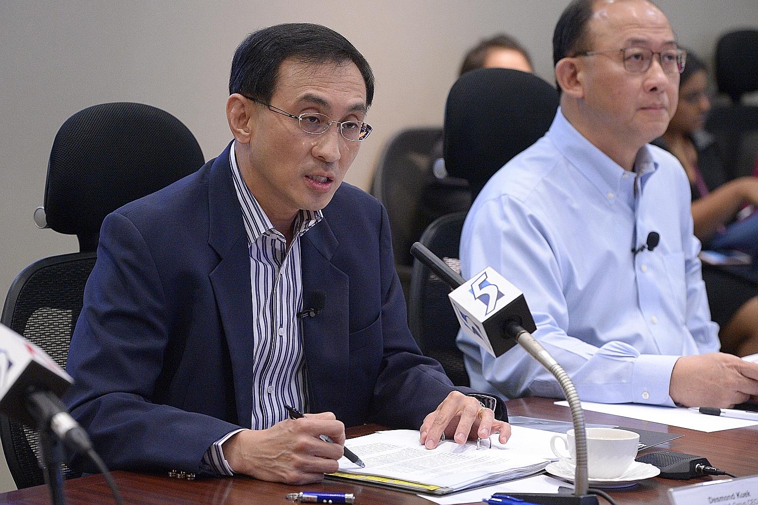 Mr Kuek at the press conference last evening after LTA announced that it will take over all of SMRT's operating assets to free the rail operator to focus on improving its service levels. On his left is group chief financial officer Manfred Seah.