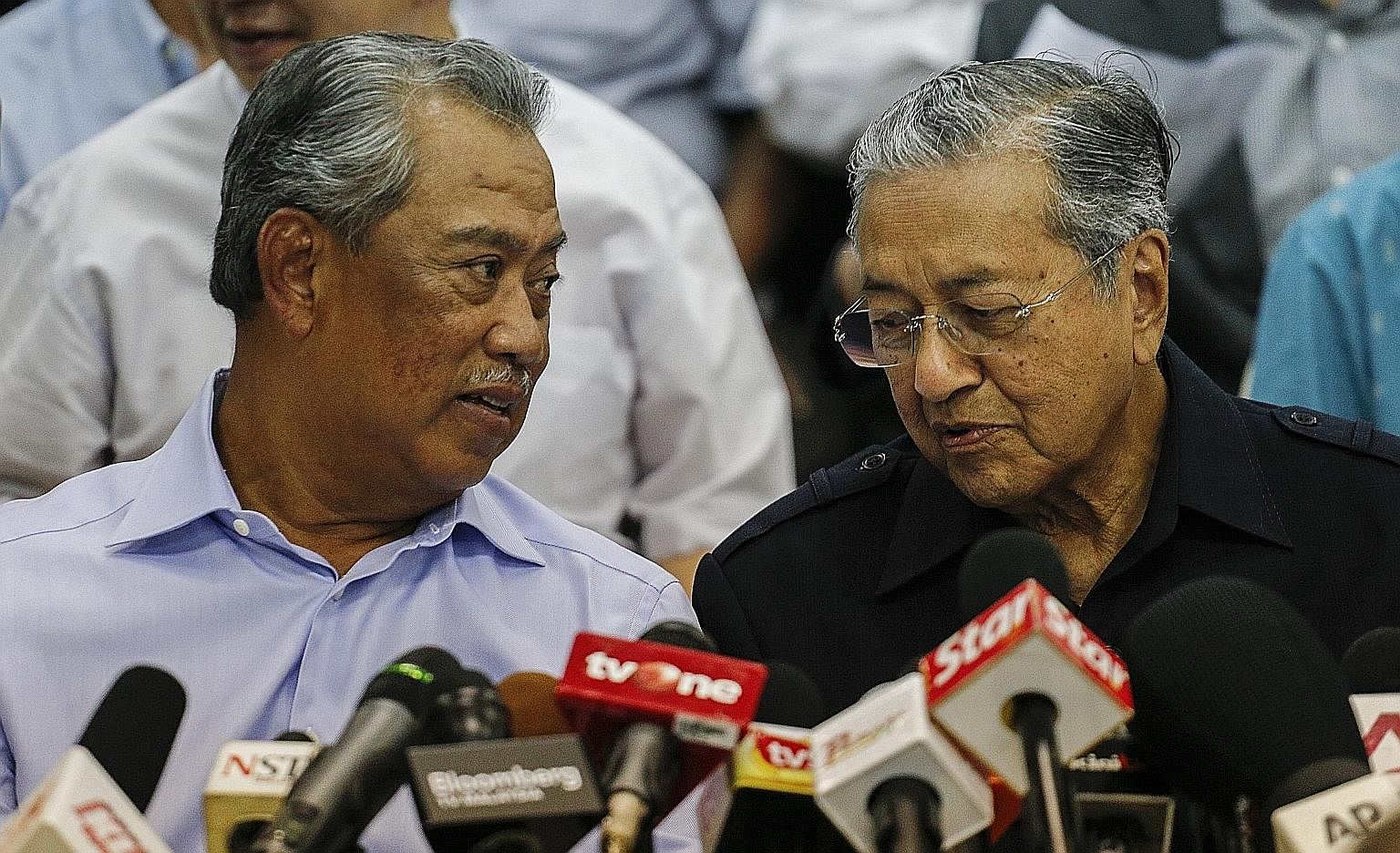 Dr Mahathir (right) with Tan Sri Muhyiddin at a media event in March. Dr Mahathir's move to force a change of leadership from outside Umno shows he no longer has clout within the ruling party. But it is not known what position Mr Muhyiddin, Umno's fo