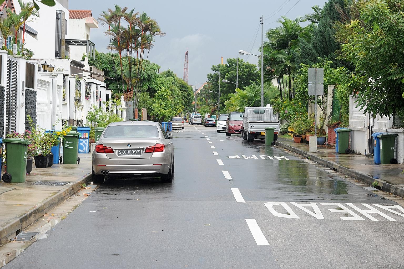 Cars parked on both sides of the two-lane road outside landed homes in a private estate in Sembawang can make navigating the area almost impossible at busy times.