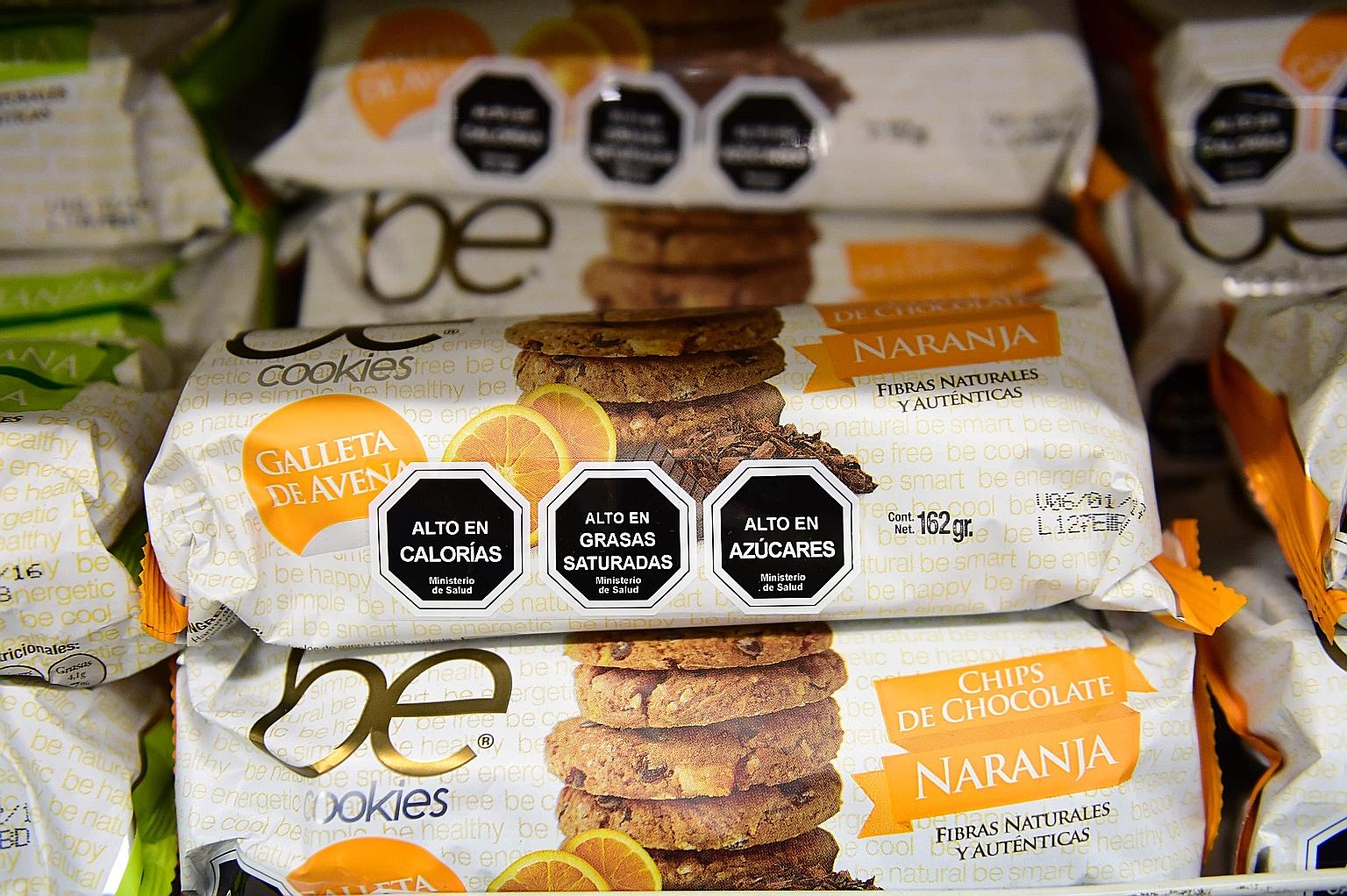 Cookies with labels stating their high content of sugar, calories and saturated fat in Santiago, Chile.