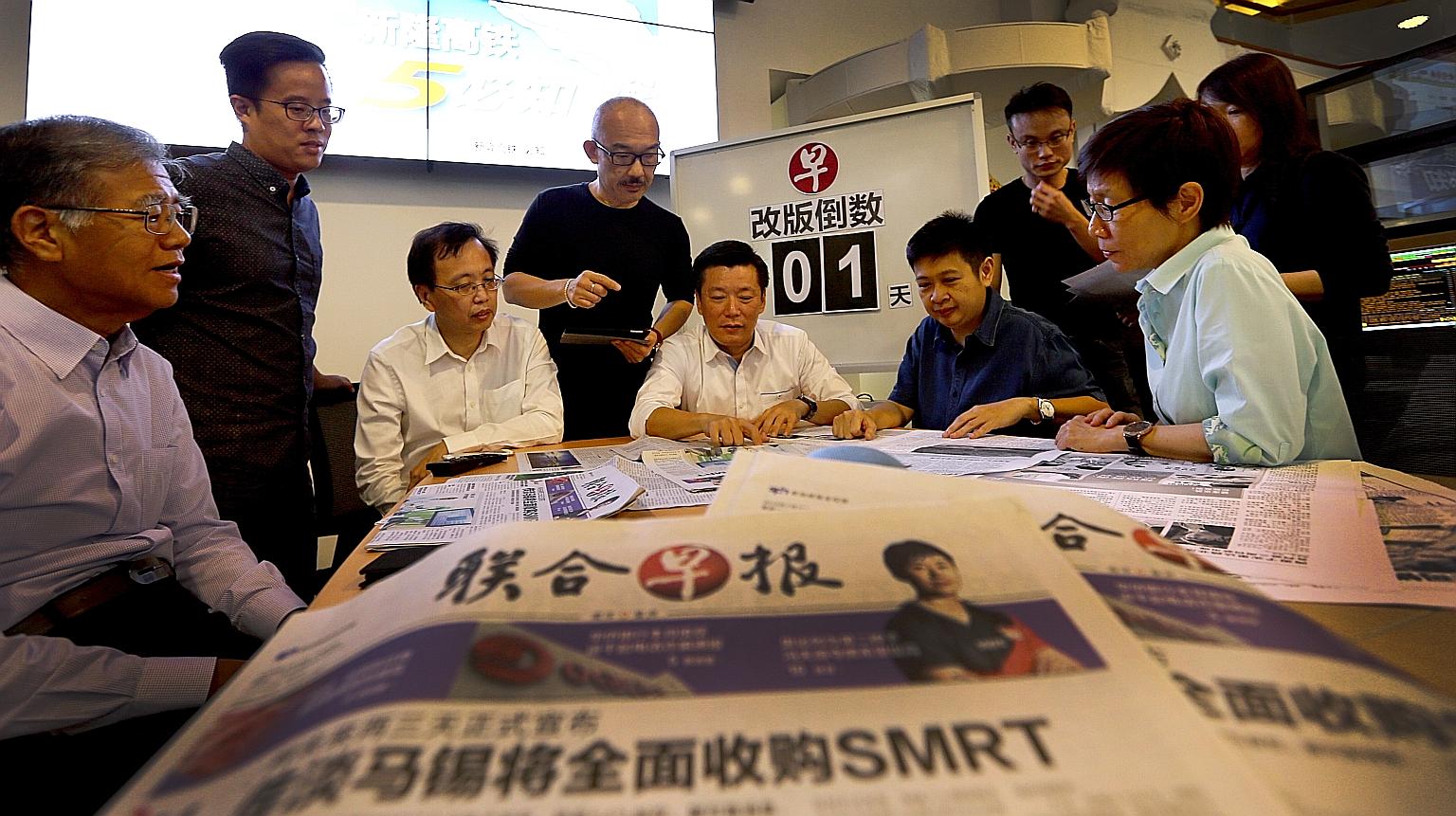 Lianhe Zaobao editor Goh Sin Teck (seated, centre) in discussion with other senior editors on enhancing the paper's reading experience for its audience. The revamped Chinese daily hits the streets today with new content and design.